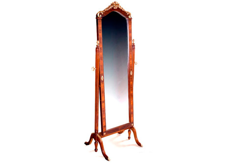 An exquisite transitional Louis XVI and Rococo style ormolu-mounted veneer inlaid cheval mirror, The mirror plate inset a veneer inlaid and filet wooden frame ornamented with ormolu rosettes to the center and the bottom, The palisander veneer inlaid serpentine top crested with an intricate Rococo style ormolu mount of a tied acanthus volute issuing two laurel garlands terminating with acanthus C scrolls, The two fluted sides supports ornamented with an ormolu acorn finials and foliate ormolu keys to control the movement of the mirror plate, Raised on a central horizontal support with ormolu palmette on turned fluted baluster supports and cabriole splayed legs decorated with ormolu acanthus leaves